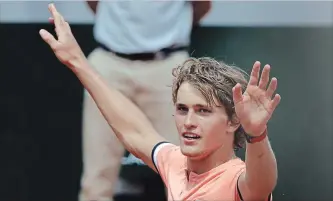  ?? ALESSANDRA TARANTINO THE ASSOCIATED PRESS ?? Germany’s Alexander Zverev celebrates winning his fourth-round match at the French Open against Russia’s Karen Khachanov in five sets, 4-6, 7-6 (7-4), 2-6, 6-3, 6-3, at the Roland Garros Stadium in Paris on Sunday. He expects another five-setter in the...