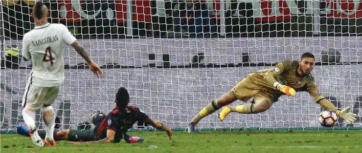  ?? REUTERS pic ?? AC Milan goalkeeper Gianluigi Donnarumma makes a save against AS Roma at the San Siro Stadium on Sunday. Roma won 4-1.