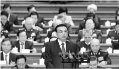  ?? — Reuters photo ?? Li delivers a government work report during the opening session of the NPC at the Great Hall of the People in Beijing, China. Li warned the world’s second-largest economy faces severe challenges, signalling a further decelerati­on as he announced a...