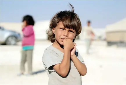  ??  ?? An internally displaced child is pictured at a Syrian camp in Ain Issa, north of Raqqa. (Reuters)