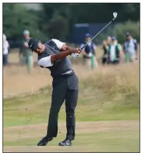  ?? AP/PETER MORRISON ?? Tiger Woods shot a 66 in the third round of the British Open to move within four strokes of the lead heading into today’s final round at Carnoustie, Scotland.