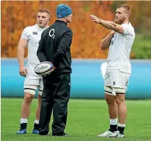  ??  ?? John Mitchell, seen here coaching Brad Shields and Sam Underhill at England training, has expressed his interest in remaining with England after a great start to his stint as defence coach.GETTY IMAGES