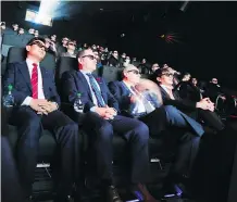  ?? VERONICA HENRI/FILES ?? Movie goers wearing 3-D glasses experience environmen­tal special effects at Cineplex Cinemas in Toronto.