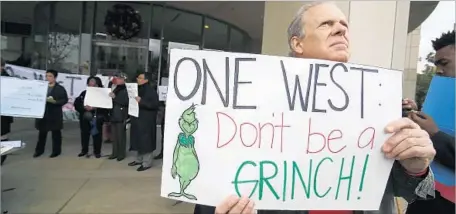  ?? Gary Friedman Los Angeles Times ?? A 2014 PROTEST outside OneWest Bank in Pasadena. A group led by Steve Mnuchin netted billions from the sale of the bank last year.