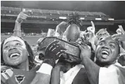  ?? MARCO GARCIA/USA TODAY PHOTO ?? Southern Methodist players celebrate with the Hawaii Bowl trophy after defeating Fresno State 43-10 late Monday night. SMU (7-6) continued to thrive when scoring first, improving to 15-0 over the past two-plus seasons.