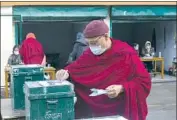  ?? Ashwini Bhatia Associated Press ?? A MONK is among hundreds of Tibetans in exile in Dharamsala, India, who turned out to cast ballots for a new political leader and parliament in exile.