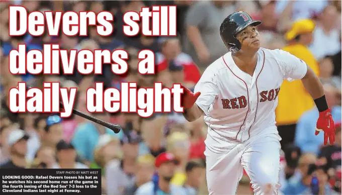 ?? STAFF PHOTO BY MATT WEST ?? LOOKING GOOD: Rafael Devers tosses his bat as he watches his second home run of the game in the fourth inning of the Red Sox’ 7-3 loss to the Cleveland Indians last night at Fenway.