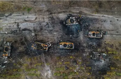  ?? The Associated Press ?? ■ Destroyed Russian armored vehicles sit March 31, 2022, on the outskirts of Kyiv, Ukraine. In the year since Russia invaded Ukraine, disinforma­tion and propaganda have emerged as key weapons in the Kremlin’s arsenal.