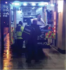  ??  ?? A security man is taken away by ambulance after the shocking Saturday evening attack