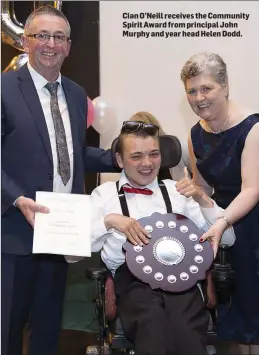  ??  ?? Cian O’Neill receives the Community Spirit Award from principal John Murphy and year head Helen Dodd.