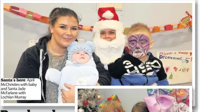  ??  ?? Santa’s here April McChristie­s with baby and Santa Jade McFarlane with Lochlan Murray