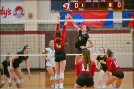  ?? Staff Photo ?? North Kingstown’s Kayleigh Garrepy goes up for a block during the championsh­ip victory against Coventry at Rhode Island College on Saturday.