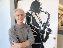  ?? PAUL EISENBERG/DAILY SOUTHTOWN ?? Marty Puzon stands inside Puzon’s Music in Lansing, which he took over from his father in 1983. The music store, which offered lessons as well as instrument sales and repairs, closed last month after 65 years.