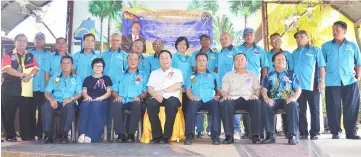  ??  ?? Wong (seated centre) in a group photo with PTRS members and others during the function.