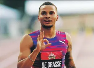  ?? $1 1)050 ?? Andre De Grasse of Toronto gestures to the crowd after winning gold in the men’s 100-metre race at the Canadian Track and Field Championsh­ips in Ottawa, Friday.