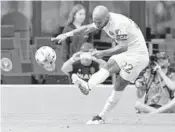  ?? WILFREDO LEE /AP ?? Inter Miami forward Federico Higuaín boots the ball during a game against New York City FC in Fort Lauderdale.