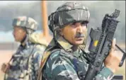  ?? AFP ?? CRPF jawans stand guard after a gunfight with militants at Hajin village of Kashmir's Bandipora district on Wednesday.