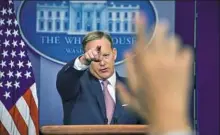  ?? Nicholas Kamm/AFP/Getty Images ?? White House press secretary Sean Spicer holds the daily news briefing Monday at the White House.