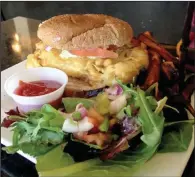  ?? Arkansas Democrat-Gazette/SEAN CLANCY ?? Yes, it’s vegan. The Fish Sandwich is made of fried cauliflowe­r.