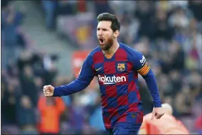  ?? JOAN MONFORT - THE ASSOCIATED PRESS ?? Barcelona’s Lionel Messi celebrates after scoring his side’s opening goal during a La Liga soccer match against Eibar on Feb. 22at the Camp Nou stadium in Barcelona.