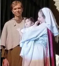  ?? CHURCH OF THE HOLY TRINITY ?? Tala Mazzawi, whose parents are from Nazareth, fills in as baby Jesus in a church play after the original star fell ill.