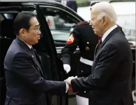  ?? Anna Moneymaker/Getty Images ?? President Joe Biden greets Japanese Prime Minister Fumio Kishida at the White House on Tuesday. The two leaders are meeting ahead of an official state visit at the White House on Wednesday.