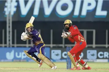  ?? SPORTZPICS / IPL ?? Responsibl­e knock: Knight Riders captain Eoin Morgan cuts en route to an unbeaten 47 to steer his team home in a lowscoring contest against Punjab Kings in Ahmedabad. Knight Riders strolled through to its target of 124 with ve wickets and more than four overs to spare.