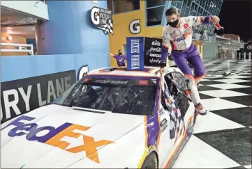  ?? Ap-wilfredo Lee ?? Denny Hamlin jumps from his car after winning a NASCAR Cup Series race in Homestead, Florida, on Sunday.