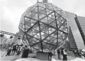  ?? JULIE WALKER AP ?? Organizers practiced raising and lowering the New Year’s Eve ball in Times Square on Saturday.