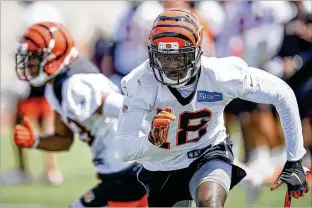  ?? ASSOCIATED PRESS ?? Wide receiver A.J. Green heads downfield during the first day of Bengals training camp. The day did not end well for Green, who limped off after hurting his ankle.