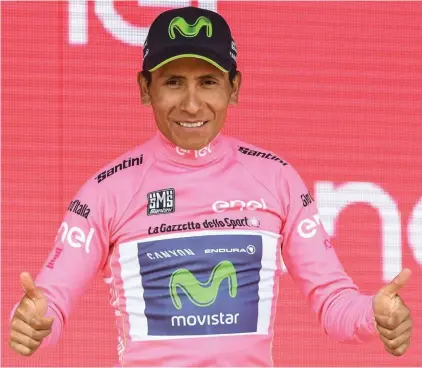 ??  ?? Colombian rider Nairo Quintana wears the pink jersey of the overall leader as he celebrates on the podium after the 19th stage of the Giro d’Italia, Tour of Italy cycling race, from San Candido to Piancavall­o