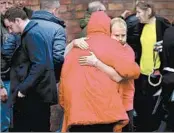  ?? CHRISTOPHE­R FURLONG/GETTY ?? Family members of the 96 Hillsborou­gh victims react after being told that charges would be filed against six people.