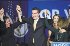  ?? Cliff Owen / Associated Press ?? Democrat Ralph Northam’s victory in Virginia’s gubernator­ial race Tuesday is viewed by members of his party as a sign that they will log more wins in next year’s midterm elections.