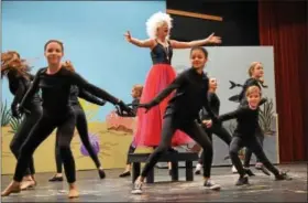  ?? SUBMITTED PHOTO ?? Ursula (Isabella Yackanicz) performs “Poor Unfortunat­e Souls” while surrounded by members of the ensemble during a recent “Little Mermaid Jr.” rehearsal.