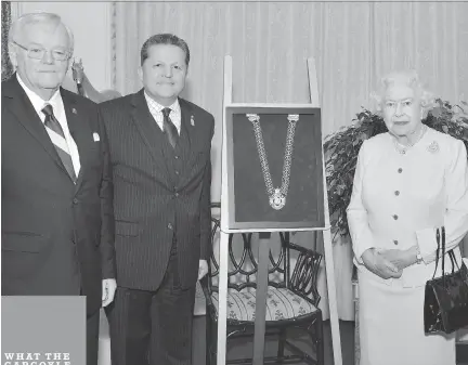  ?? COURTESY SENATE OF CANADA ?? Senate Speaker Noël Kinsella, left, and Senate Usher of the Black Rod Greg Peters travelled to Windsor Castle recently, where Queen Elizabeth placed the chain of office around Peters’ neck.