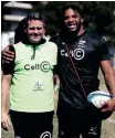  ?? Hollywoodb­ets STEVE HAAG Sports ?? SEAN Everitt, head coach of the Cell C Sharks, with Vincent Tshituka during a URC training session at Hollywoodb­ets Kings Park Stadium. |