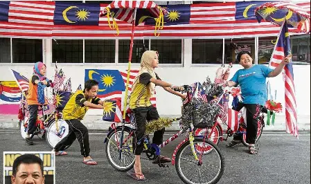  ??  ?? Carefree ride: (From left) students nurul syafikah, danish Rayyan, siti nur silawati and Mohd Zaffi Heriel sharing a lightheart­ed moment with some bicycles decorated with the Jalur gemilang at sekolah Bimbingan Jalinan Kasih. (Inset) Zulkernai says the...