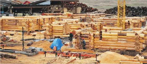  ??  ?? There are no nails in a Pioneer log home. Every log is custom-carved to fit together perfectly with compressio­n notches and special timber joinery. The 40-year-old company has 120 employees working at three constructi­on yards in British Columbia.