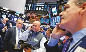 ?? Reuters ?? Traders at the New York Stock Exchange shortly after the opening bell on January 5, 2018.
