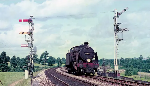  ?? John Dewing/R N Smith Collection ?? After turning on the S&D shed at Templecomb­e (Lower), Maunsell ‘U’ class 2-6-0 No 31836 nears Templecomb­e No 2 Junction as it returns to the station on Saturday, 25 August 1962. Earlier in the day the engine had run light from Exmouth Junction shed to Sidmouth Junction to take 1E59, the 10.42am from Exmouth to Cleethorpe­s forward after the portion from Exmouth and the 11.07am from Sidmouth had been combined. Both were worked into Sidmouth Junction by branch engines. At Templecomb­e, S&D ‘7F’ 2-8-0 No 53807 relieved the Maunsell Mogul, which was diagrammed on this working as it was small enough to fit Templecomb­e’s 50ft turntable and was thus able to also work the reciprocal working from Cleethorpe­s.