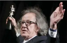  ?? MICHAEL SOHN — THE ASSOCIATED PRESS FILE ?? In this file photo, Australian actor Geoffrey Rush poses with his ‘Berlinale Camera Award.’