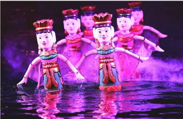  ??  ?? Photo shows water puppets performing at the Thang Long theatre in Hanoi. — AFP photo