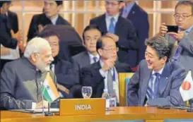  ?? PTI PHOTO ?? n Prime Minister Narendra Modi interacts with his Japanese counterpar­t, Shinzo Abe, at the Regional Comprehens­ive Economic Partnershi­p Leaders’ Meeting, in Manila, Philippine­s, on Tuesday.