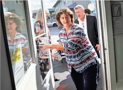  ?? DEB CRAM/PORTSMOUTH HERALD ?? Executive Director Tammy Josyln opens the door to the improved Warming and Cooling Center at Operation Blessing prior to the official ribbon cutting on Wednesday.