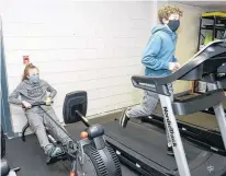  ?? JASON MALLOY • THE GUARDIAN ?? Grade 9 students Juliette Bader and Lucas MacKenzie use some of the equipment in the new wellness room at Queen Charlotte Intermedia­te School in Charlottet­own.