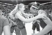  ?? Elaine Thompson Associated Press ?? STANFORD’S Erica McCall, right, and Karlie Samuelson celebrate winning the Pac-12 tournament.