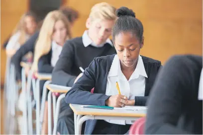  ?? ?? PICKING THEIR BRAINS. Matric pupils write an exam. Questions should be asked about the system, an expert says. Picture: iStock