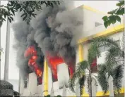  ?? AFP ?? Smoke billows from a factory window after it was set ablaze by anti-China protestors in Binh Duong, Vietnam, on Wednesday.