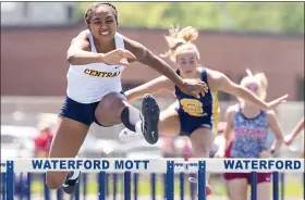  ?? TIMOTHY ARRICK — FOR MEDIANEWS GROUP ?? Walled Lake Central’s Kylei Anderson, left, took home first place in the girls 100-meter hurdles with a time of 14.96seconds besting her nearest competitio­n by 1.35seconds at the Lakes Valley Conference track meet on Saturday at Waterford Mott High School.