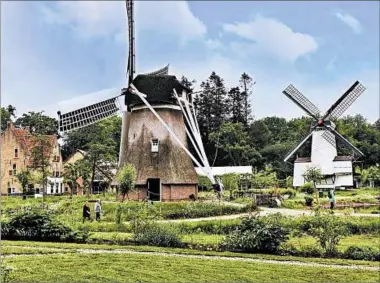  ?? SANDRA HUNDACKER/RICK STEVES’ EUROPE ?? From historic buildings to elegant windmills to live folk music, the Netherland­s Open Air Museum in Arnhem is a one-stop look at traditiona­l Dutch culture.